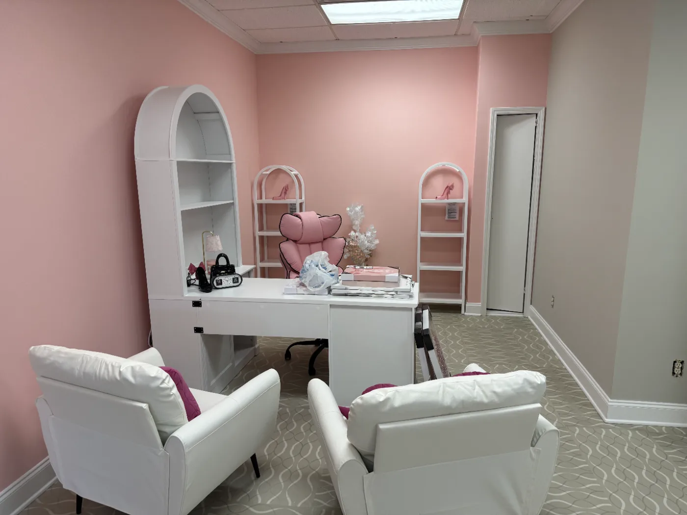 Salon suite repainted in soft pink with white trim and built-ins in Columbia SC