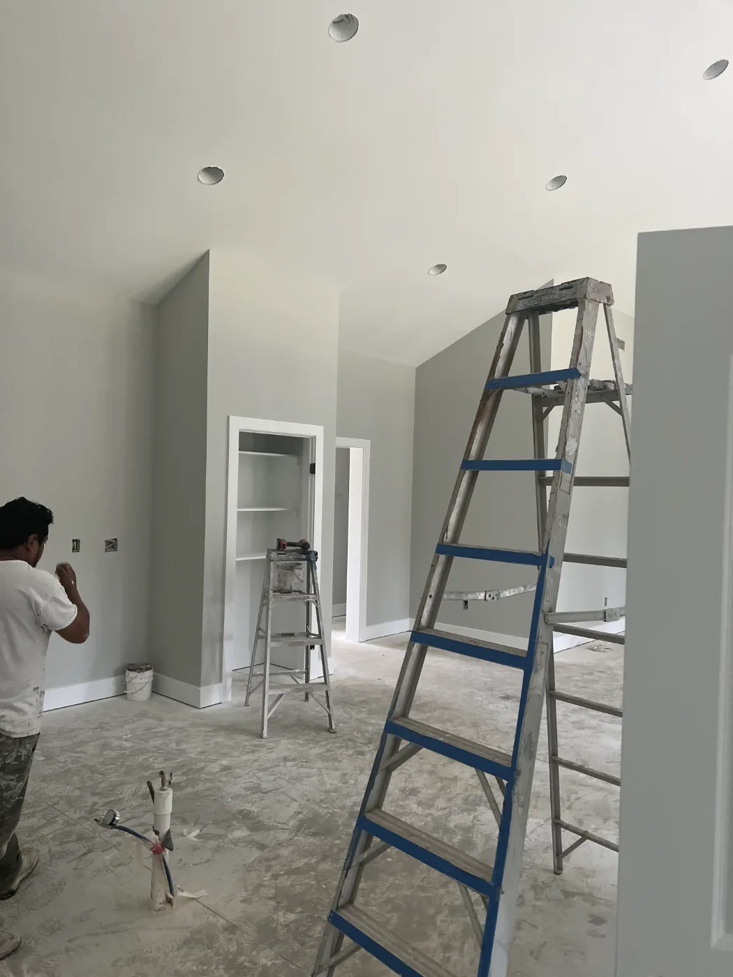 TAP painter cutting in a wall during an interior repaint on a Columbia SC job site