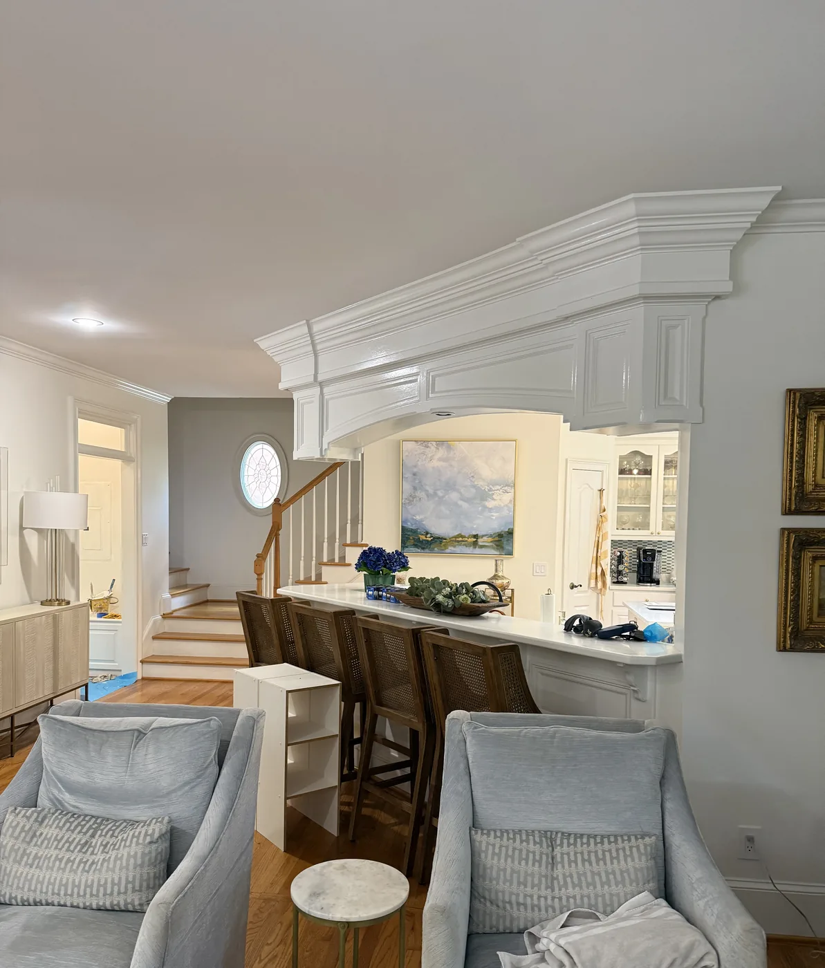 Kitchen archway with painted white millwork and heavy crown molding in a Columbia SC home
