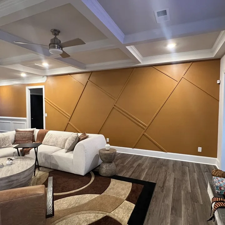 Living room with a gold paneled accent wall painted by TAP Custom Painting in Columbia SC