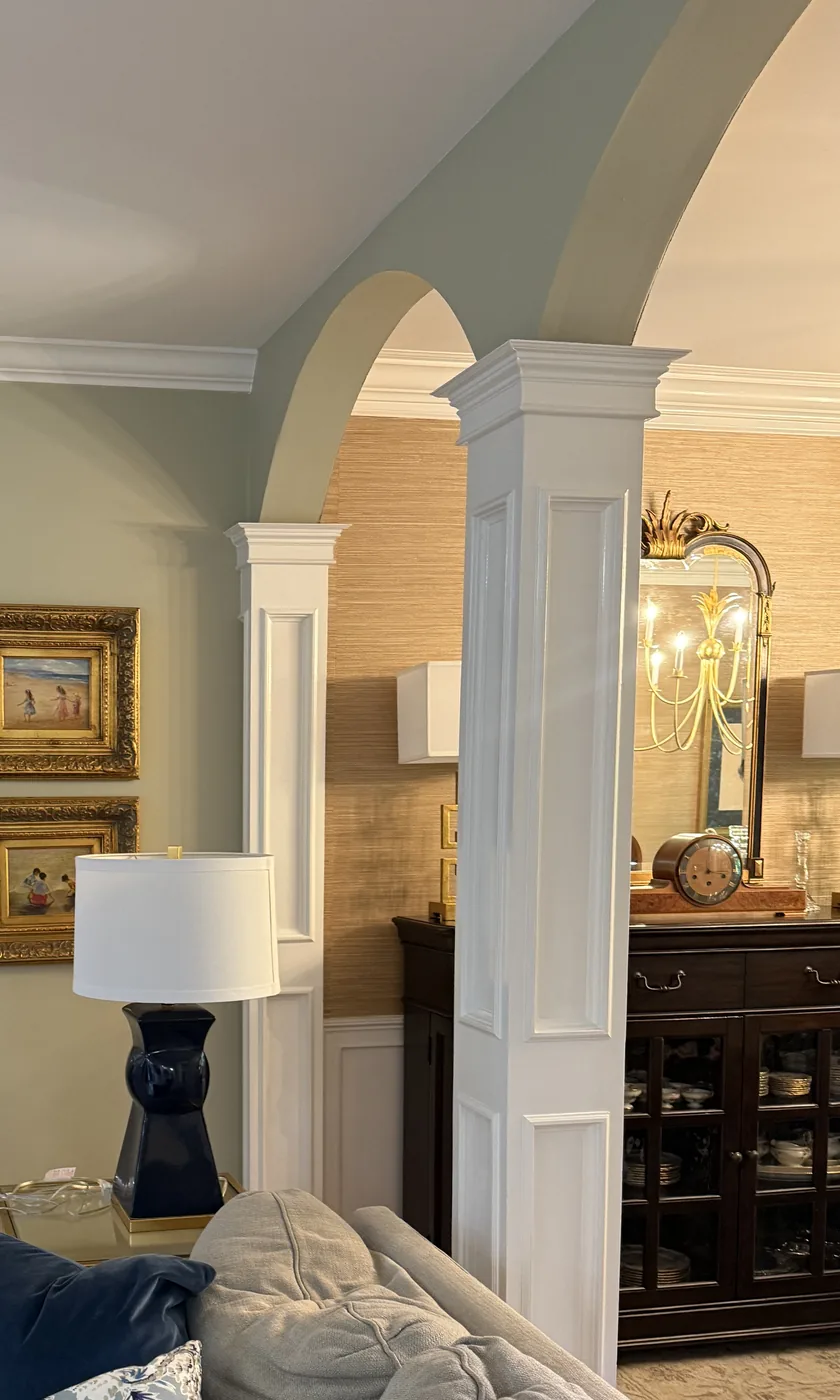 Painted white columns and archway between a living room and dining room in Columbia SC